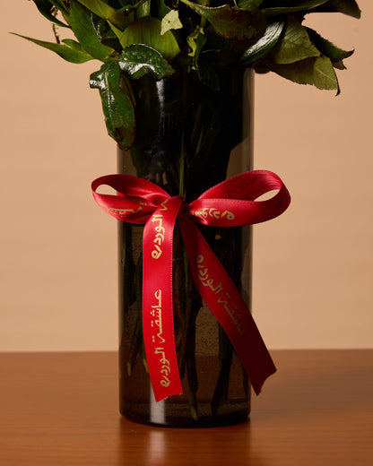 Red Roses In Black Vase