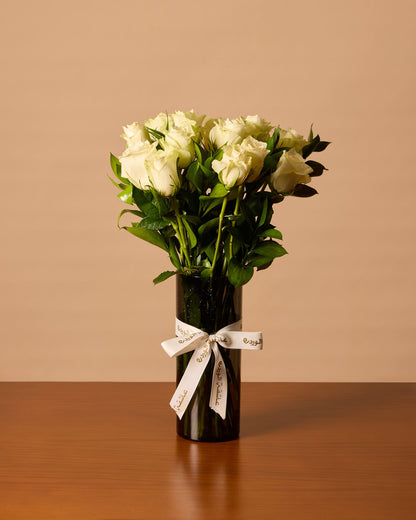 White Roses In Black Vase
